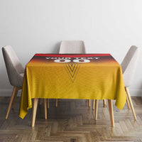 Red and gold football tablecloth on a square table with "00" style center design