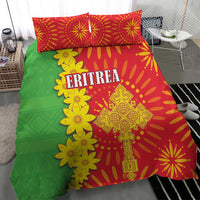 Bed bedding set featuring green base, red burst pattern, and yellow floral motifs with ERITREA