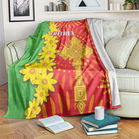 Red and green folk-pattern blanket with yellow flowers and 'ERITREA' print