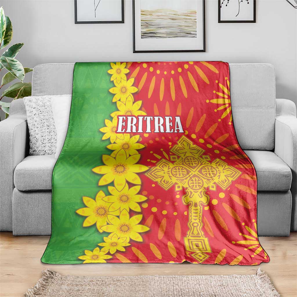 Green and red folk-pattern blanket with yellow flower print and 'ERITREA' lettering