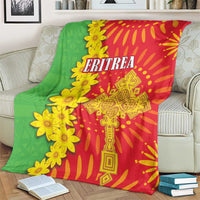 Green and red folk-pattern throw blanket with yellow flowers and ornate Eritrea emblem