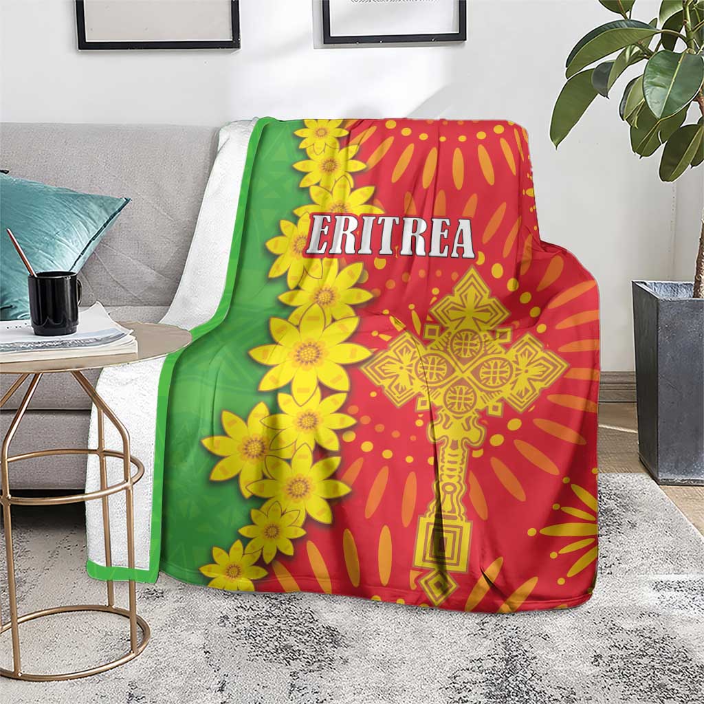 Red and green folk-pattern blanket with large yellow flower cluster and 'ERITREA' text