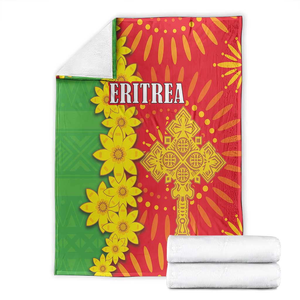 Folded red and green folk-pattern blanket with yellow flowers and 'ERITREA' text set