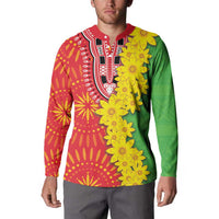 Button sweatshirt with red, green, and yellow design and yellow flower cluster on chest