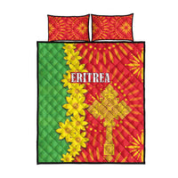 Red and green quilt bed set with yellow floral and geometric pattern, plus two pillows