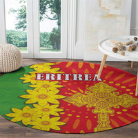Round folk-pattern carpet with green background, yellow flowers, and ERITREA text on red