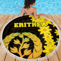 Round Eritrea beach blanket with fringe, black and yellow floral design and green tree motif