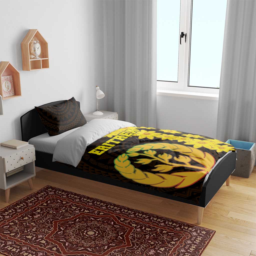 Black bedding set on bed; yellow floral and tree emblem design on duvet and pillow covers