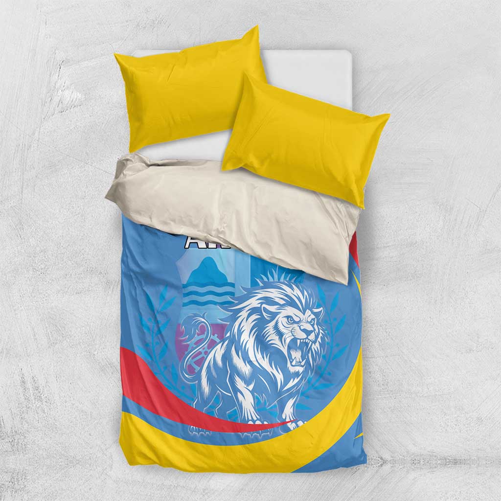 Aruba bedding set with two yellow pillows: blue duvet shows roaring lion and ARUBA lettering
