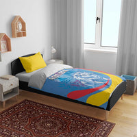 Aruba bedding set in bedroom: blue duvet with roaring lion emblem and ARUBA title, yellow accent pillows