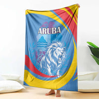 Blue Aruba blanket draped on sofa with roaring lion graphic and red/yellow/blue stripes