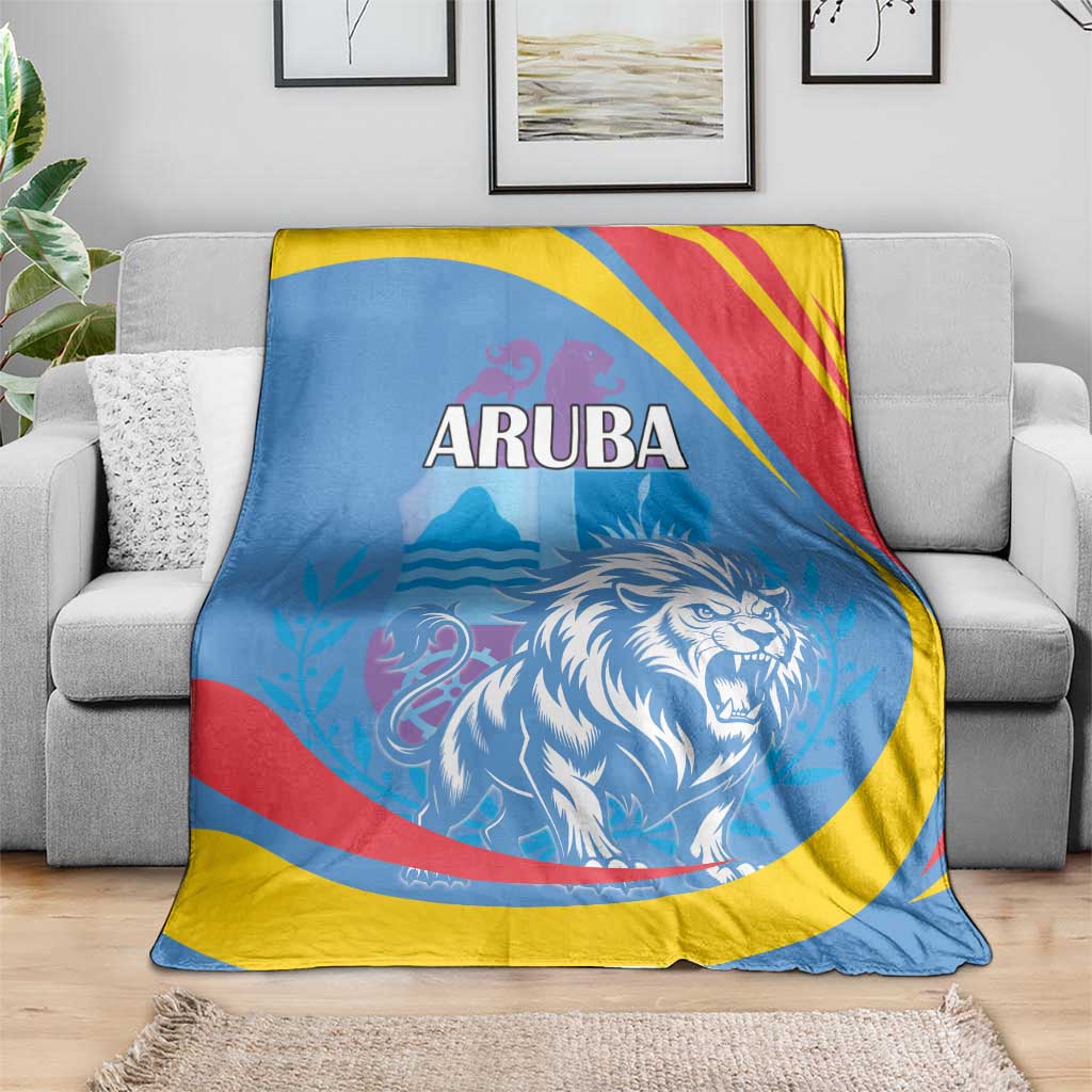 Blue Aruba blanket on gray sofa with roaring lion graphic and red/yellow/blue stripes