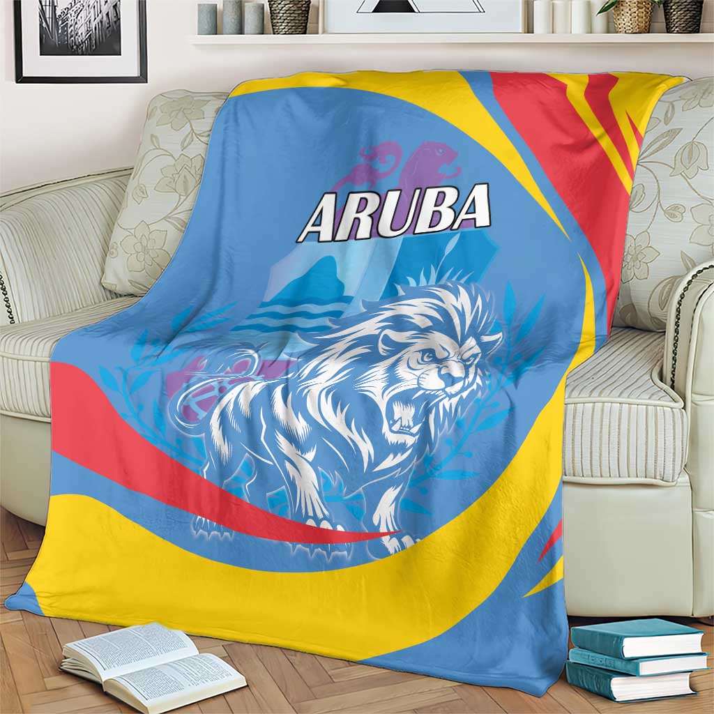 Blue Aruba blanket on beige sofa with roaring lion graphic and red/yellow/blue stripes