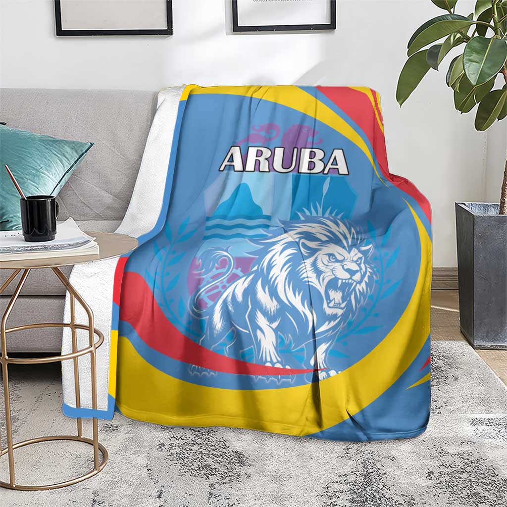 Blue Aruba blanket on gray sofa with roaring lion graphic and red/yellow/blue stripes
