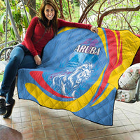 Aruba quilt blanket draped on outdoor seating, roaring lion graphic, ARUBA text, blue and yellow