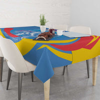 Blue, yellow, and red geometric tablecloth draped over a square table