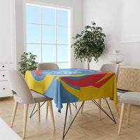 Blue, yellow, and red lion-themed tablecloth on dining table with chairs