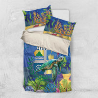 Sea turtle bedding set flat lay: blue reef duvet and two pillowcases with ARUBA