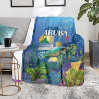 Blue sea turtle blanket with ARUBA text and colorful island landscape