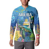 Blue button sweatshirt worn by model, sea turtle underwater print with ARUBA on front.