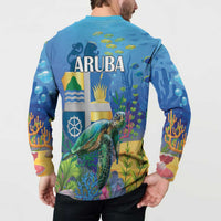 Blue button sweatshirt worn by model from back, ARUBA turtle underwater print.