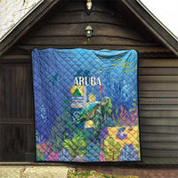 Blue sea turtle quilt with quilted diamonds, ARUBA text, and underwater landscape artwork