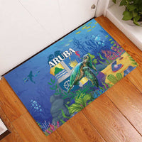Blue rubber doormat angled view, ARUBA logo with sea turtle, plants, and reef details