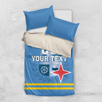 Blue bedding set with pillows; duvet shows '00 YOUR TEXT' and red star over stripes