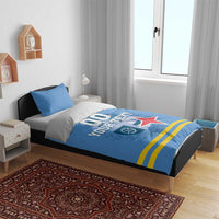 Blue bedding set with pillows; duvet features '00 YOUR TEXT', red star, and gold stripes