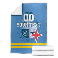 Blue custom blanket with folded white towels; custom text and red star design
