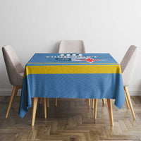Blue custom-printed tablecloth with yellow stripe border and red star crest across top