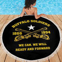 Round black beach blanket with gold '1866 1994' emblems and white fringe border