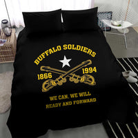 Black duvet cover and two pillows with yellow star, trumpets, “Buffalo Soldiers,” and slogan