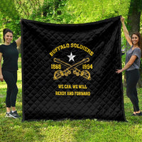 Black quilt with Buffalo Soldiers crest and crossed guitars, spread on green grass