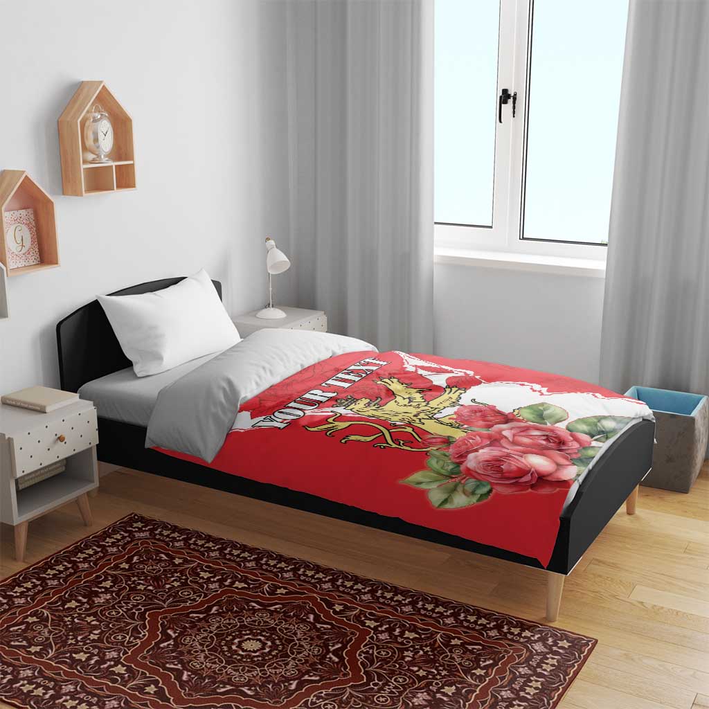 Red personalized duvet on bed with lion crest and roses, paired with white pillows