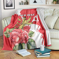 Red and white personalized blanket with roses, lion crest, and 'YOUR TEXT'.
