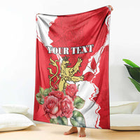 Red and white personalized throw blanket with roses, lion crest, and 'YOUR TEXT'.