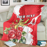 Red and white personalized blanket with rose bouquet and lion crest, 'YOUR TEXT' centered.