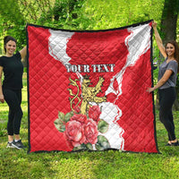 Red and white personalized quilt blanket with quilted diamond stitching, lion crest, roses.