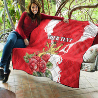 Red and white personalized quilt blanket with lion crest and large roses, quilted stitching detail.