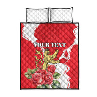 Red and white quilt bed set with two white quilted pillows, lion crest, roses, 'YOUR TEXT'.