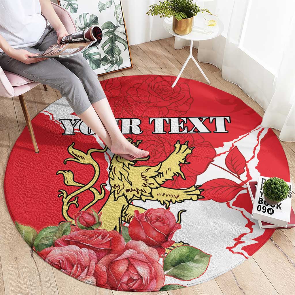 Round red area rug with lion crest and roses, showing 'YOUR TEXT' across center.