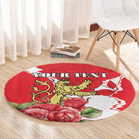 Round red area rug with lion crest and roses, displaying 'YOUR TEXT' text.