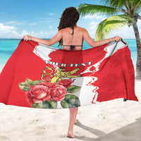 Personalized red sarong draped on back, with 'Your Text' and rose design