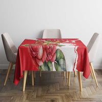 Red floral tablecloth with large rose design and white edge pattern