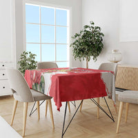 Red rose tablecloth covering dining table with coordinated chair covers