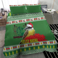 Green bedding set close view with Feliz Natal lettering, bird graphic, and patterned borders