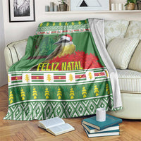 Green Christmas blanket draped on sofa, bird with Santa hat, Feliz Natal text and icons