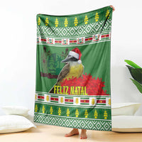 Green blanket showing bird wearing red Santa hat, Feliz Natal lettering, holiday stripes