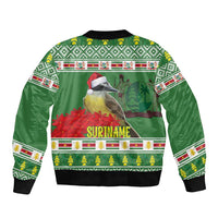Green bomber jacket with 'SURINAME' back print, jungle bird and holiday design, black ribbing.